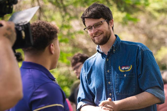 Will Lawrence talking to voter